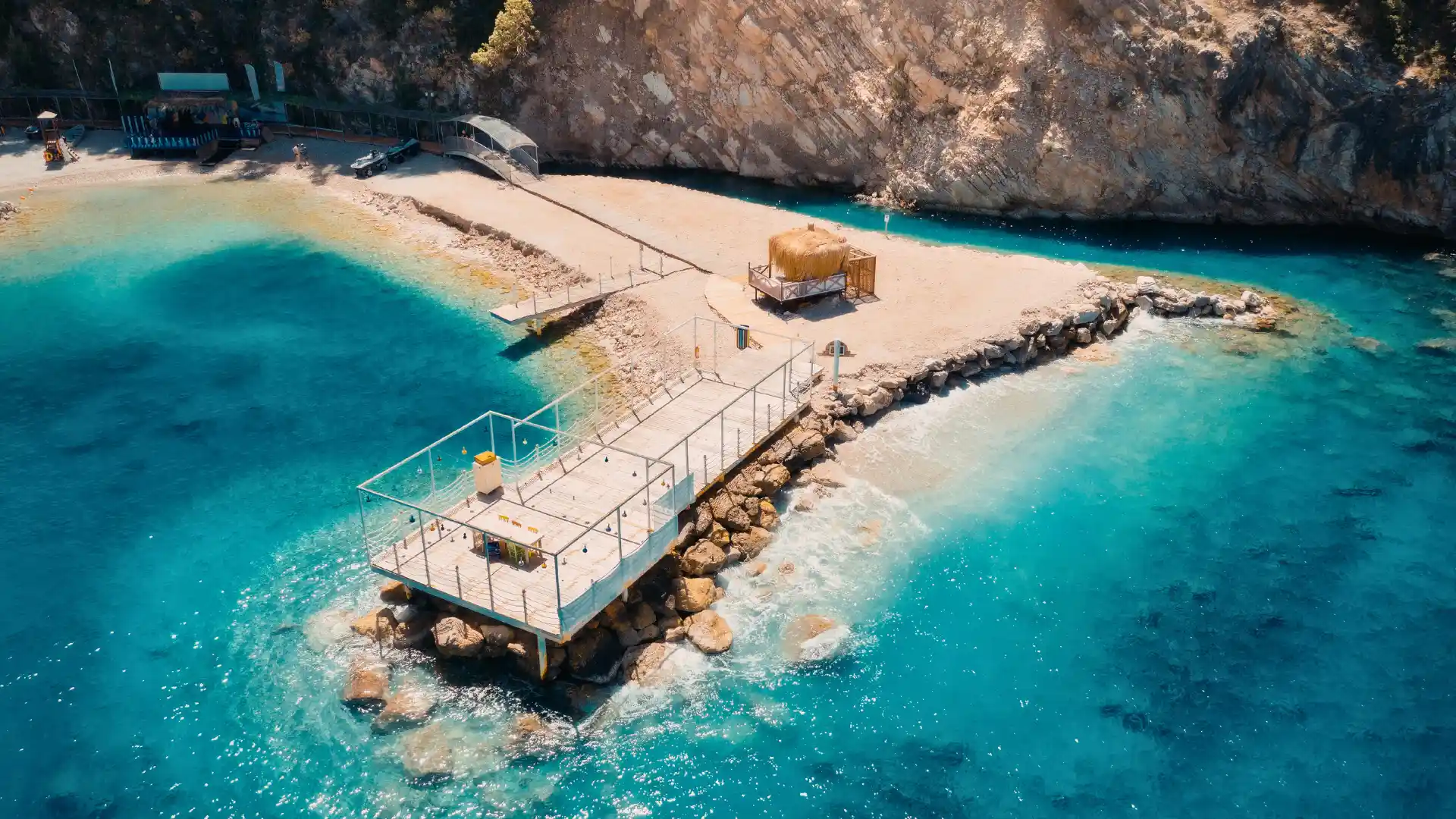 Wooden walkways over turquoise lakes